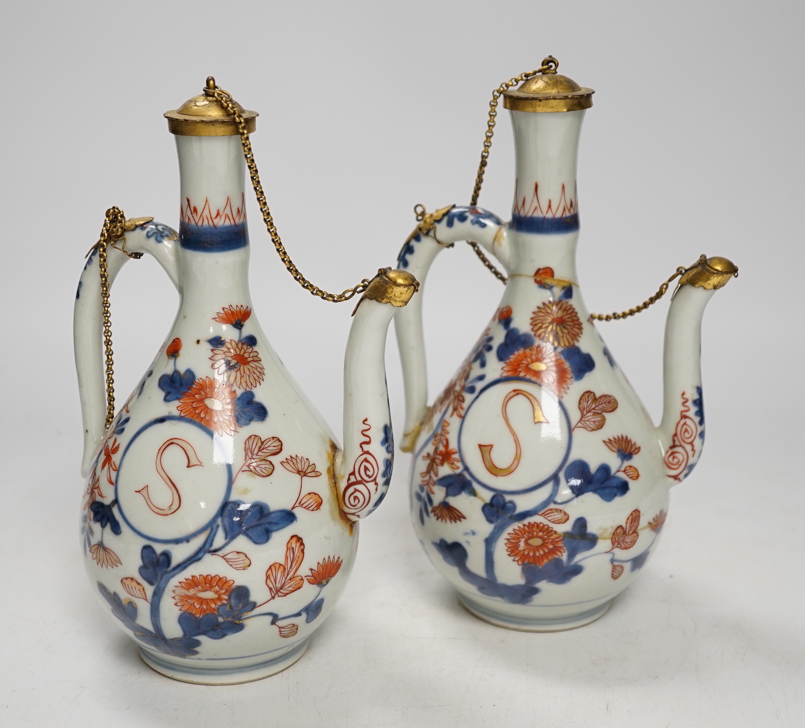 A pair of late 17th/early 18th century Japanese Arita Imari ewers, European gilt metal mounts, a/f, 20cm